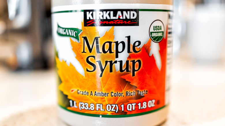 Bottle of Kirkland Signature Organic Maple Syrup on countertop