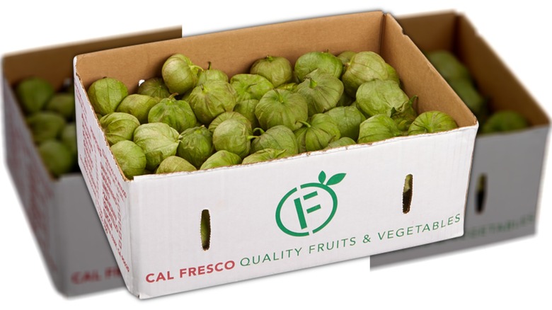 Box of green tomatillos mirrored image