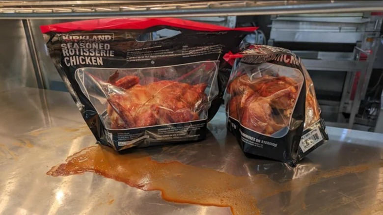 Leaking Costco rotisserie chickens in bags on metal shelf at Costco under heating lamps.