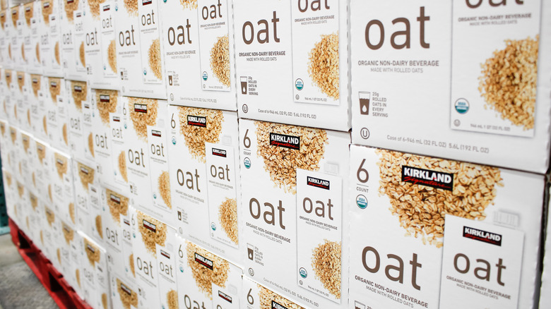A view of several stacked cases of Kirkland Signature oat milk