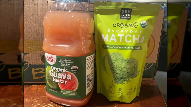 Bottle of Costco guava nectar next to package of organic matcha powder
