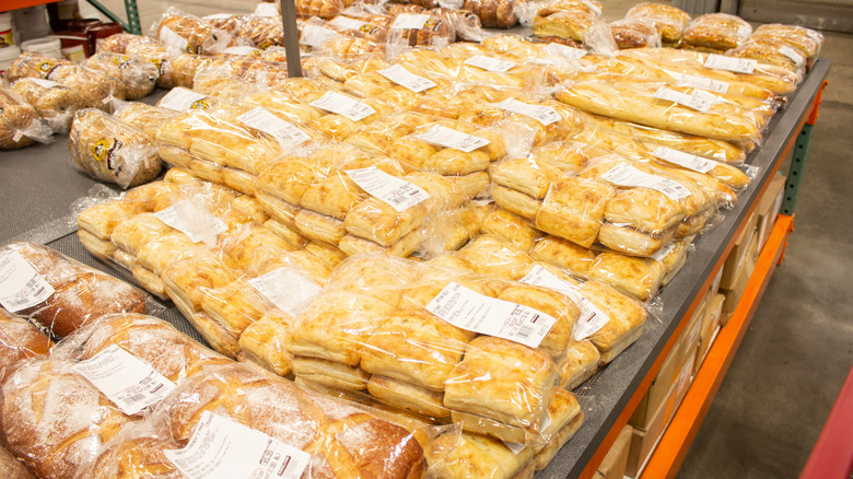 Several bags of Kirkland ciabatta rolls on display packed in bags