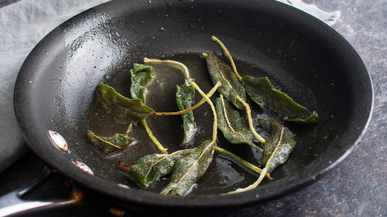Sage fried in a hot pan with butter