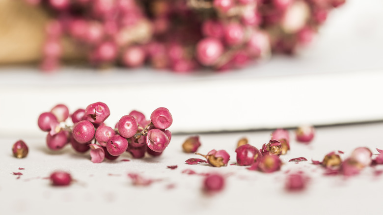 Pink peppercorn on a white counter