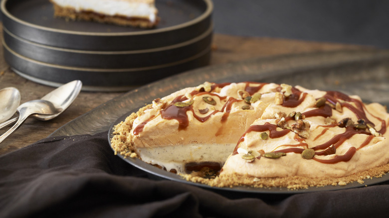 Pumpkin pie topped with caramel sauce