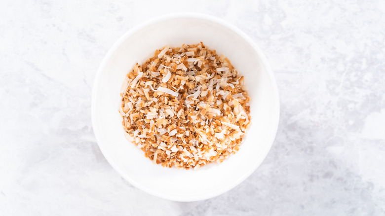Bowl of toasted coconut flakes