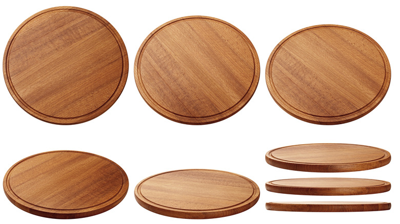 Set of wooden trays against an isolated white background