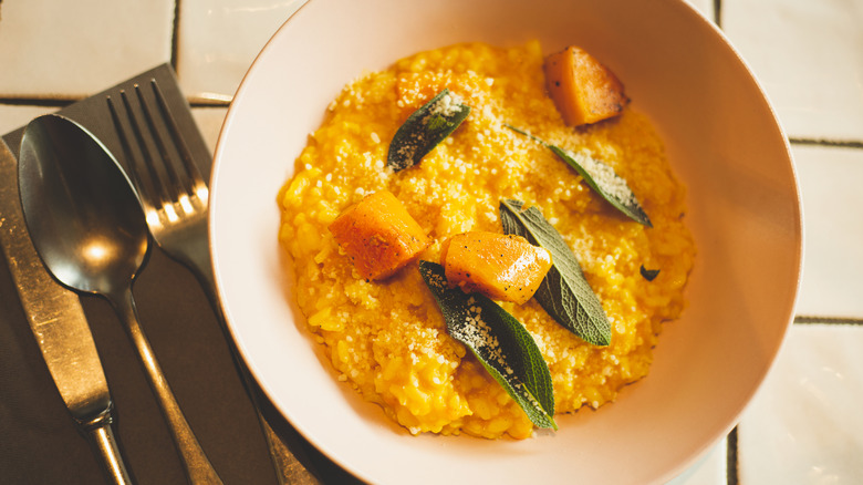 A bowl of pumpkin risotto with sage and parmesan