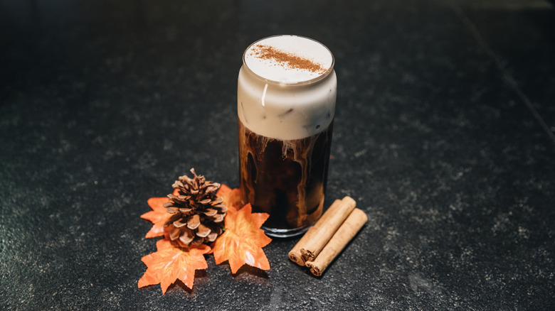 A tall coffee with a pumpkin cold foam