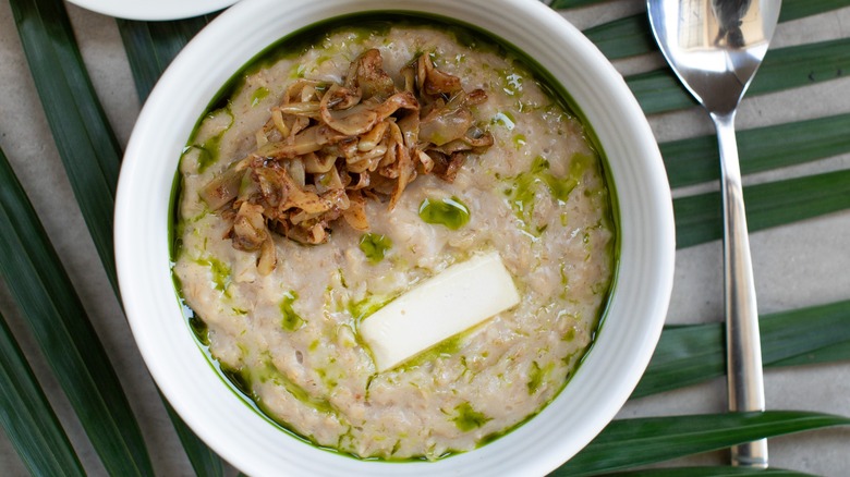 Topview of savory oatmeal with mushrooms and butter