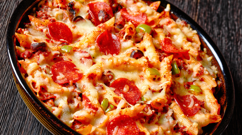 Cheesy pasta bake topped with pepperoni and green olives