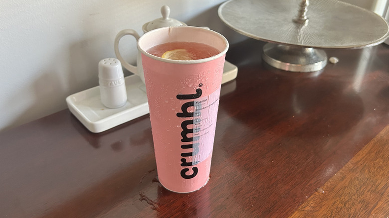 Pink Crumbl cookie cup full of dirty soda