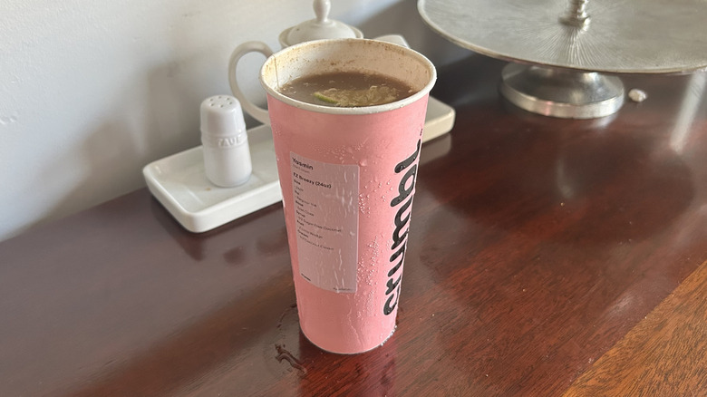 Pink Crumbl cookie cup full of dirty soda