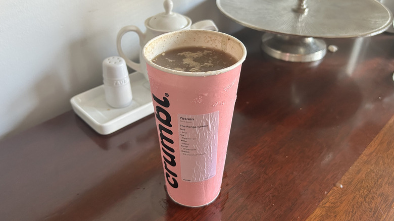 Pink Crumbl cookie cup full of dirty soda