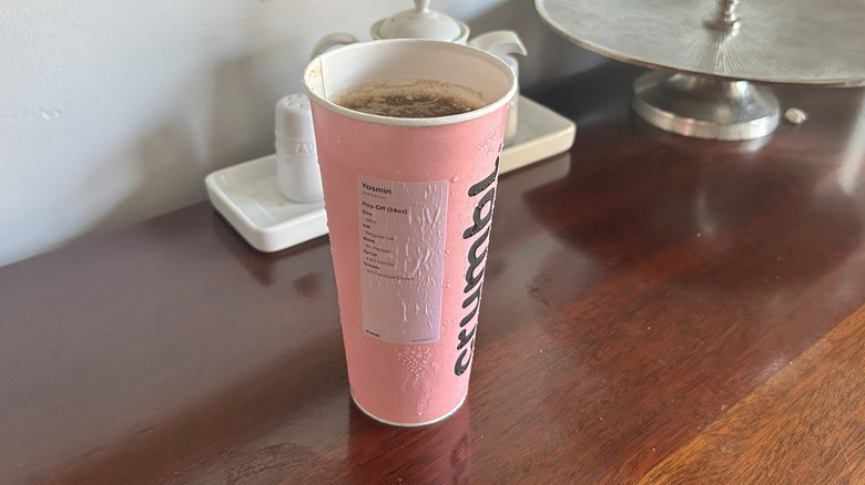 Pink Crumbl cookie cup full of dirty soda