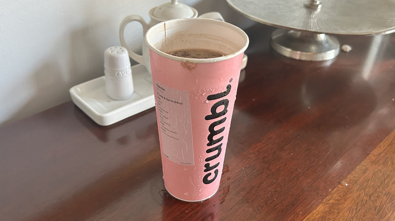 Pink Crumbl cookie cup full of dirty soda