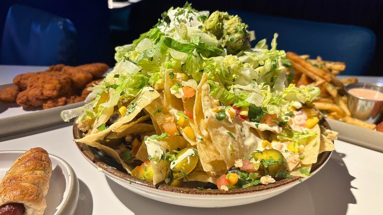 Dave & Buster's Mountain O' Nachos on white plate on white table