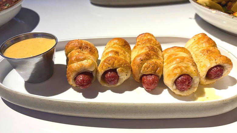 Dave & Buster's Pretzel Dogs and sauce on white plate on white table