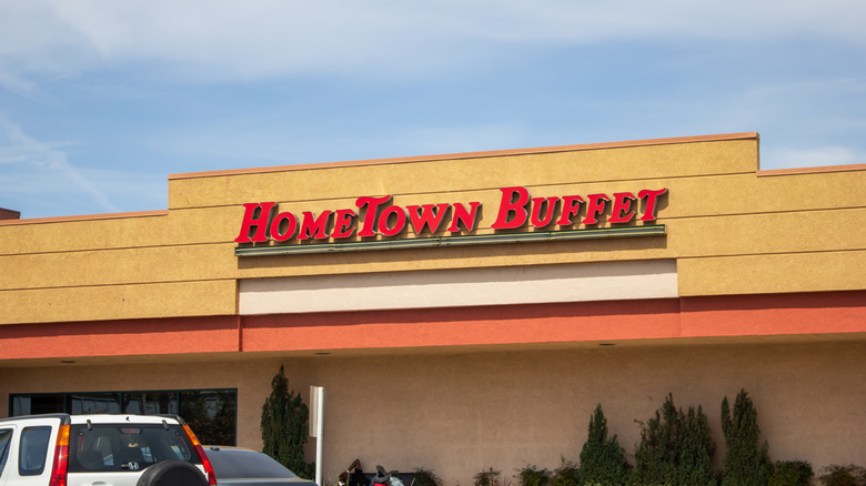 HomeTown Buffet building with sign on building and cars out front
