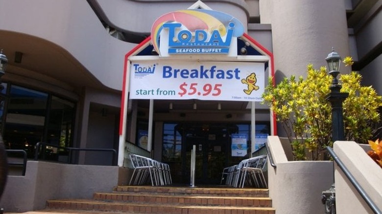 Outside building with Todai entrance and steps leading upwards to it including breakfast sign