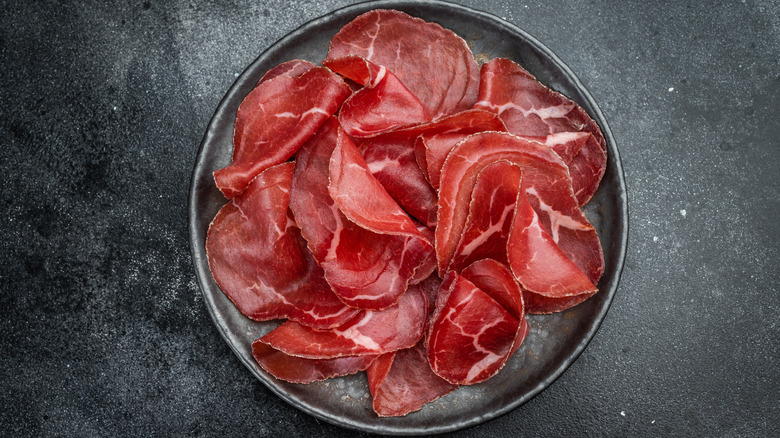 thinly sliced cecina on a plate