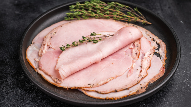 thin slices of lonza on a plate