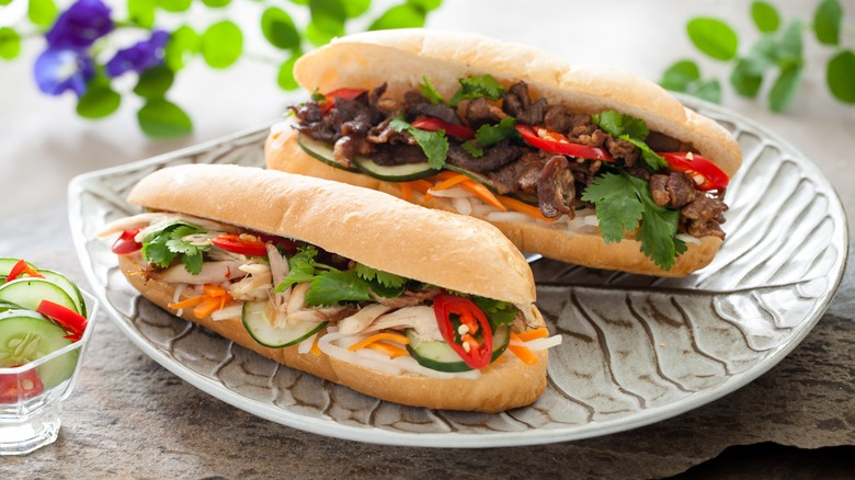 Two banh mi sandwiches on plate