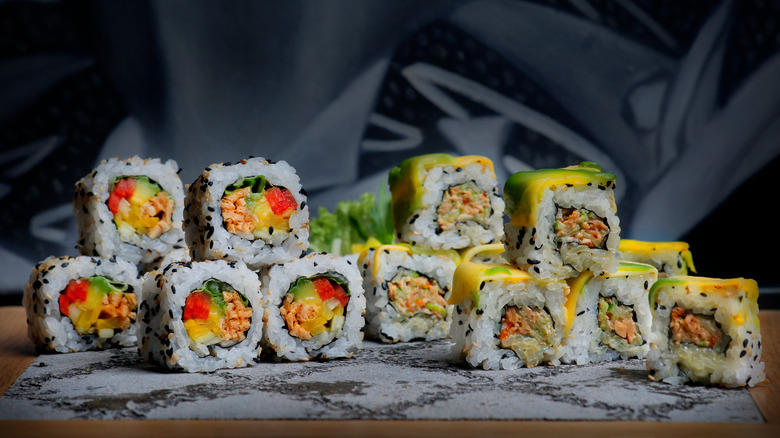 Stacks of Nikkei-style sushi rolls on table