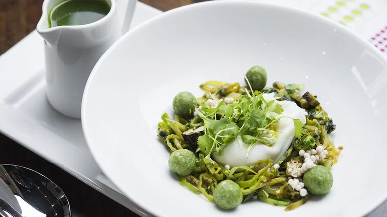 Bowl of kale matzo ball soup