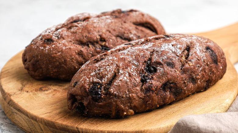 Chocolate chocolate chip sourdough loaves on cutting board