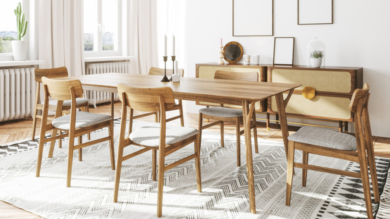 Scandinavian-style dining room with wooden chairs without armrests