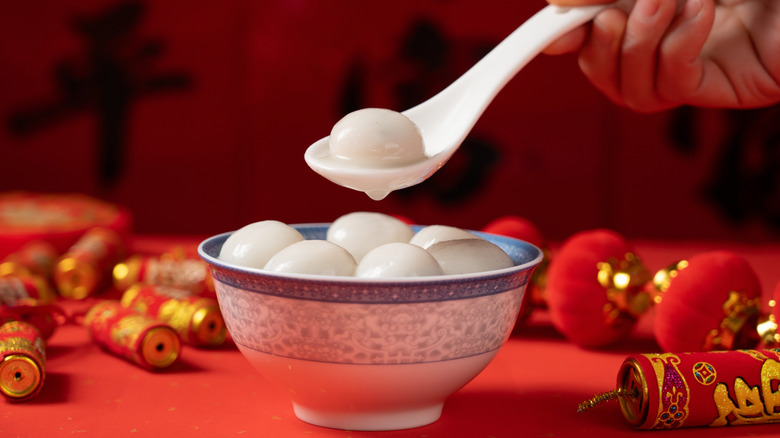 A round soft dumpling in a spoon