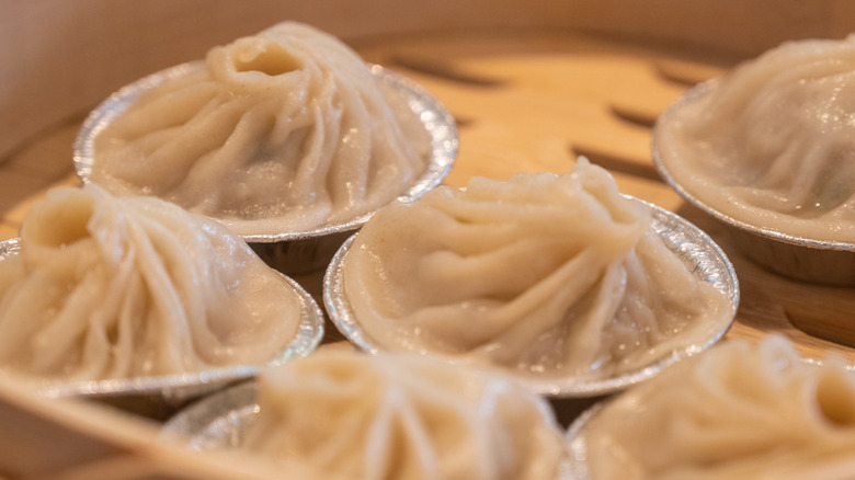 A dumpling in bamboo steamer