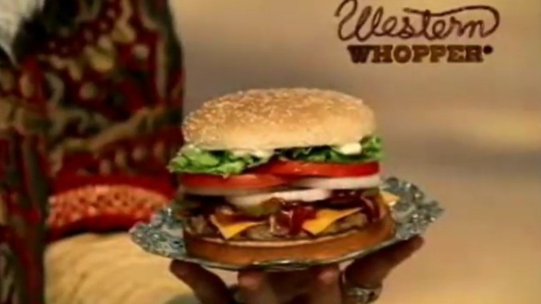 A Western Whopper with bacon, cheese, onion, tomato, and lettuce