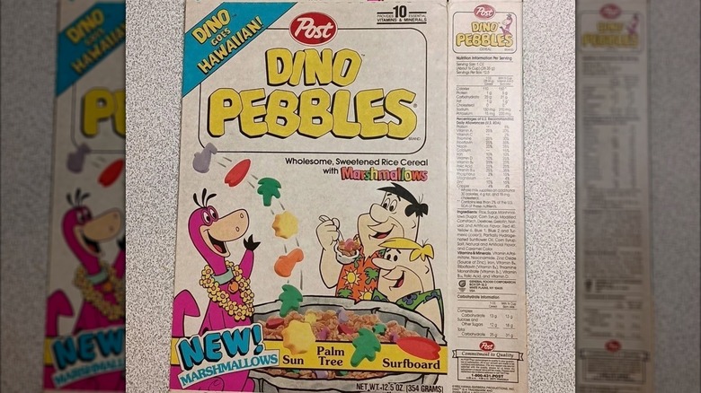 Flattened Dino Pebbles cereal box on a countertop