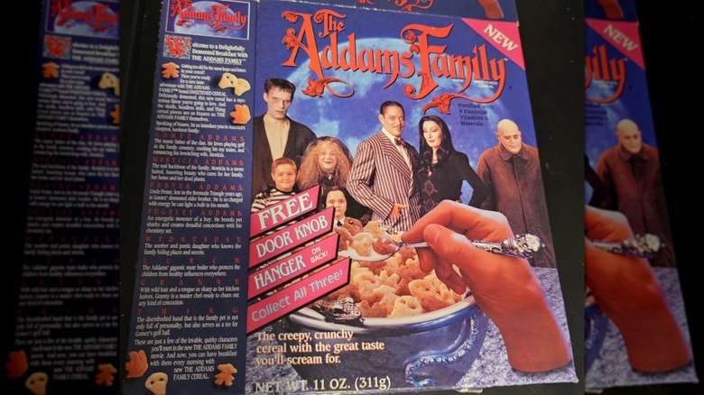 Flattened box of The Addams Family cereal on a black background