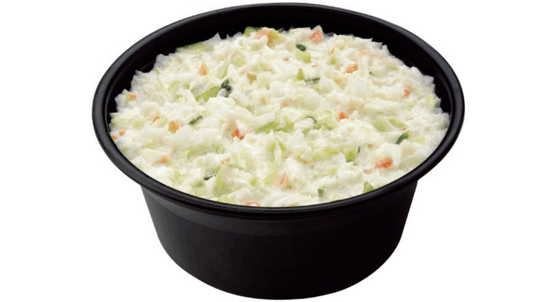 Coleslaw in black plastic bowl