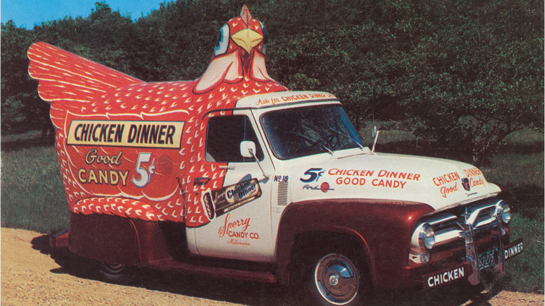 Truck in the shape of a chicken advertising Chicken Dinner bars