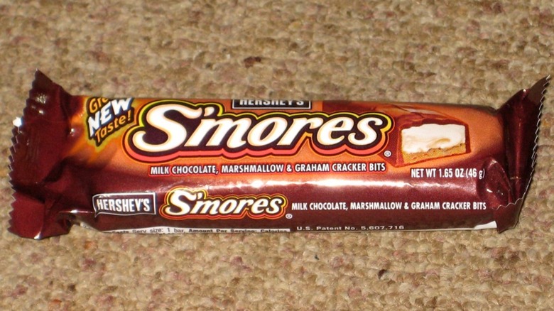S'mores bar in packaging on carpet, showing product illustration on top