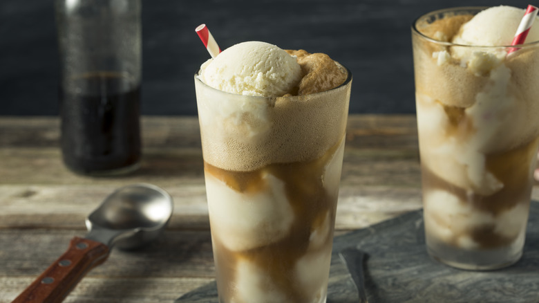 Two cups of soda floats on a table