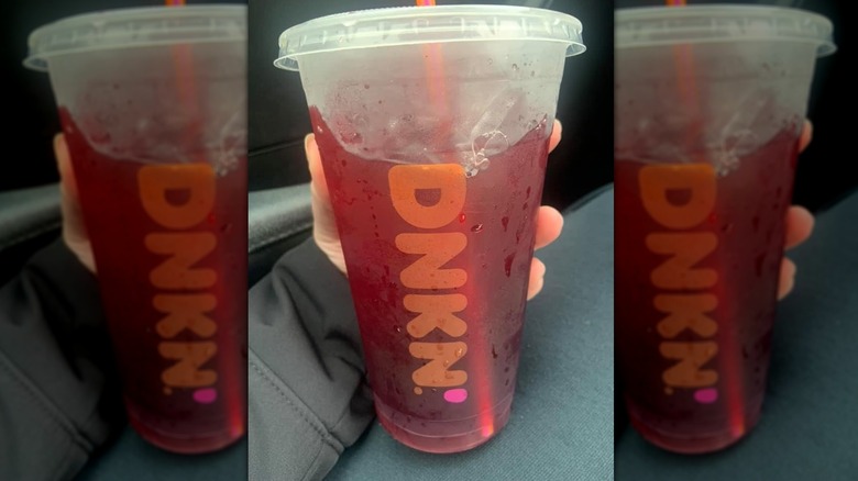 Hand holding Blueberry Pomegranate Refresher in car