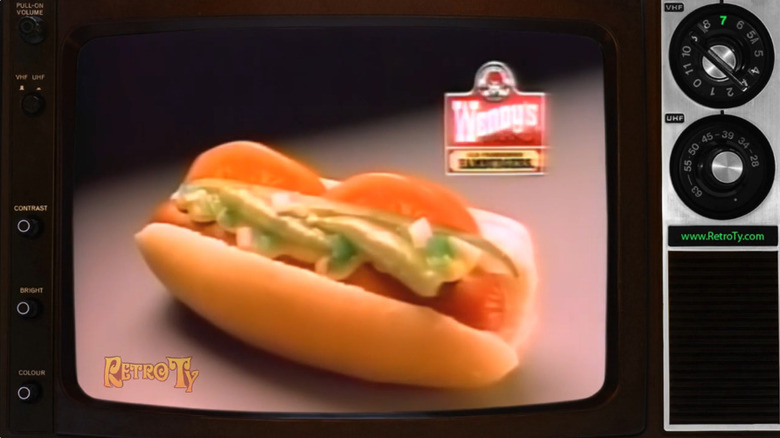 Screenshot from TV commercial for Wendy's hot dog, framed in a vintage-style television screen.