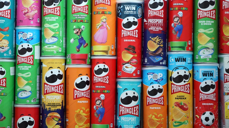 different cans of pringles all stacked and crammed together