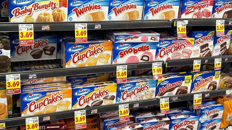 Shelves of Hostess snack cakes at the grocery store