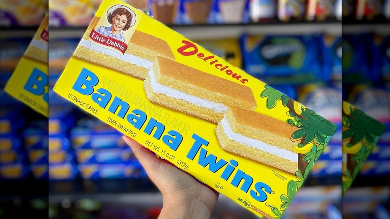 Little Debbie Banana Twins box, snack aisle out of focus in background