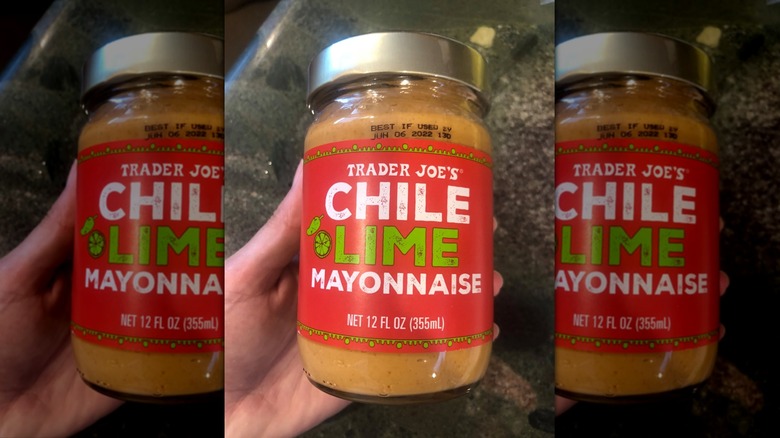 Hand holding jar of Chili Lime Mayonnaise
