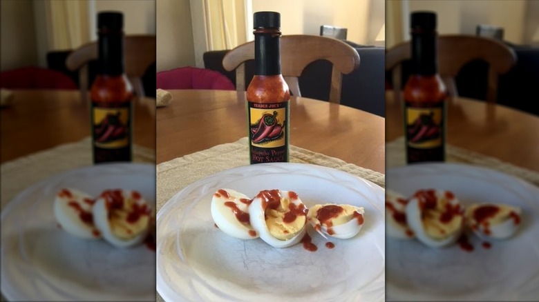 Trader Joe's Jalapeño Pepper Hot Sauce with plate of boiled eggs