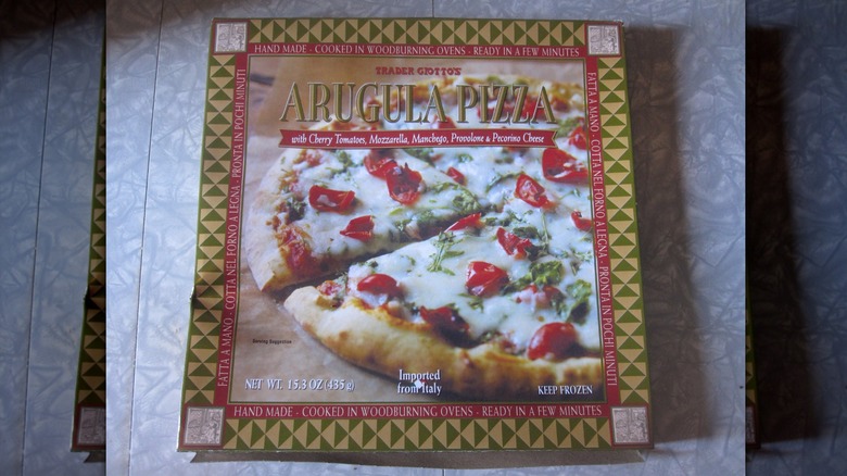 A Trader Joe's Arugula Pizza box on a counter