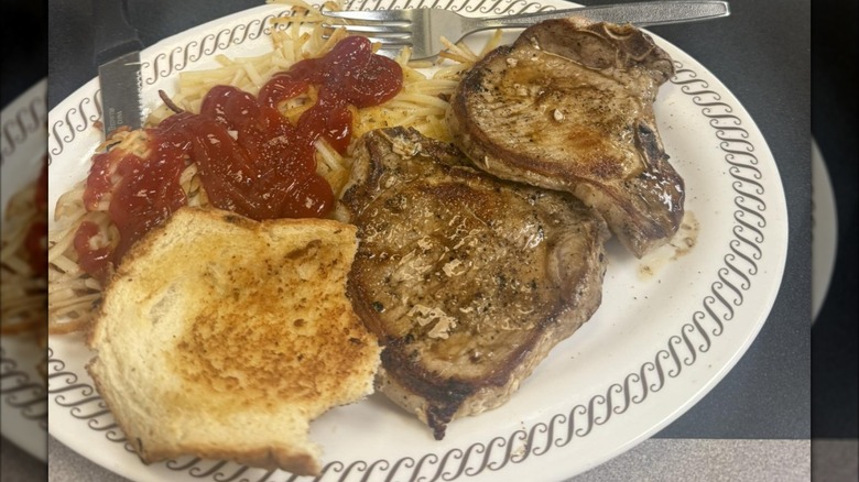 Pork chop dinner on white plate at Waffle House