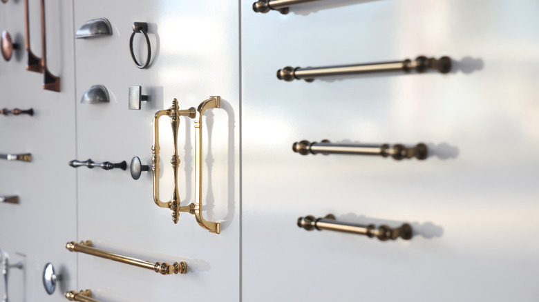 Several cabinet handles on a white background